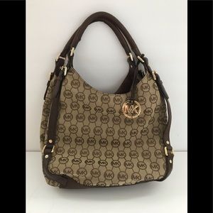 Michael Kors three pocket shoulder handbag